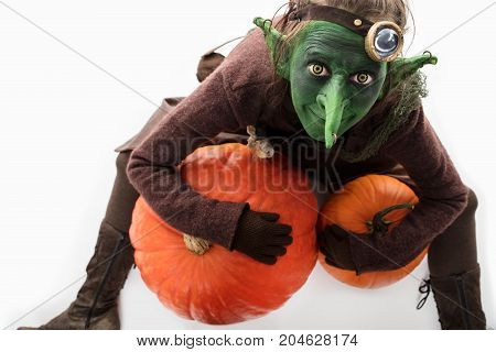 female Goblin with pumpkins freaky halloween costume