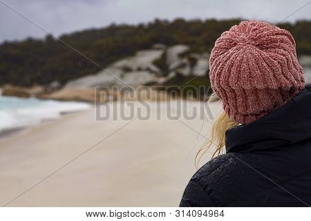 Girl In Beanie Looks Into Distance Along Beach, Hiking Girl In Nature Looks Off Into The Distance, N