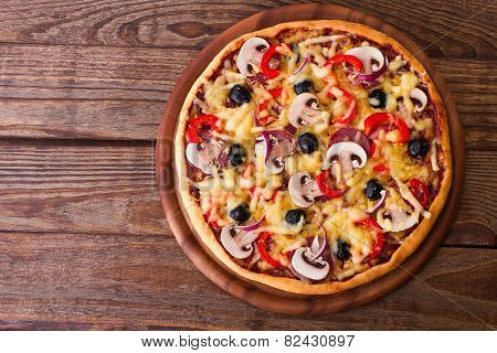 Pizza with seafood on wood table top view