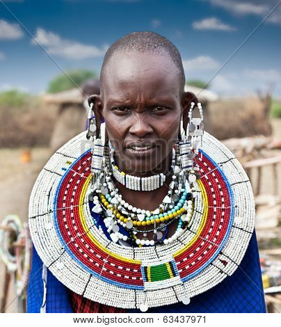 TANZANIA, AFRICA-FEBRUARY 9, 2014: Masai woman with traditional  ornaments, review of daily life of local people on February 9, 2014. Tanzania.