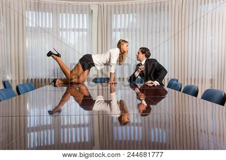 Sexy Female On Meeting Room Desk And Man In Suit. Bdsm Sado Maso Romance In Office. Woman With Colla