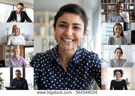 Diverse Colleagues Engaged In Webcam Team Conference On Computer