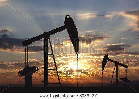 Oil pump oil rig energy industrial machine for petroleum in the sunset background