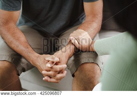 Female Friend Or Family Sitting And Hold Hands During Cheer Up To Mental Depress Man, Psychologist P