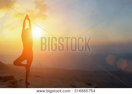 Young Women Meditate While Doing Yoga Meditation, Spiritual Mental Health Practice With Silhouette O