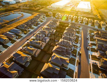 Epic Sunrise High Aerial Above Austin Texas Round Rock Suburbia Houses in simple rows and lines all the exact same a new housing development in Central Texas