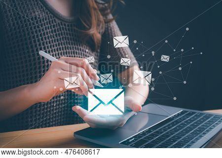 Businesswoman Hand Holding E-mail Icon Letter. Business E-mail Communication And Digital Marketing. 