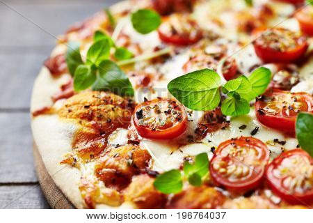 Pizza with mozzarella and cherry tomatoes