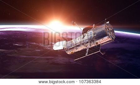 The Hubble Space Telescope in orbit above the Earth. Elements of this image furnished by NASA.