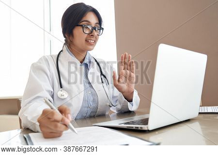 Indian Female Doctor Talk With Patient Make Telemedicine Online Webcam Video Call. Female Physician 