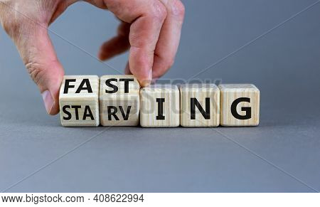 Fasting Or Starving Symbol. Doctor Turns Wooden Cubes And Changes The Word 'starving' To 'fasting'. 