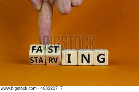 Fasting Or Starving Symbol. Doctor Turns Wooden Cubes And Changes The Word 'starving' To 'fasting'. 