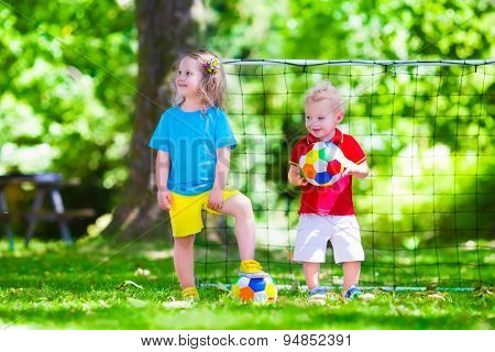 Children Playing Football Outdoors