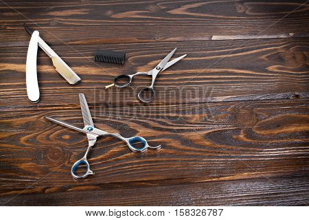 Hairdresser set with various accessories on background