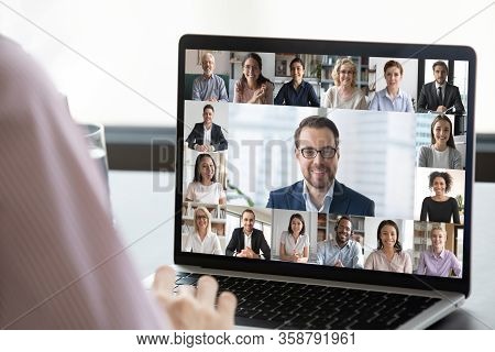 Employee Talk On Webcam Conference With Diverse Colleagues