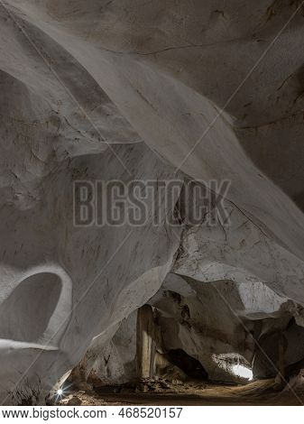 Scenic View Of Natural Stone Pattern Of Mineral Formations Underground. Many Stalactites And Stalagm