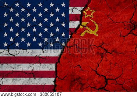 Us And Belgium Flag On Textured Cracked Ground. The Concept Of Cooperation Between The Two Countries