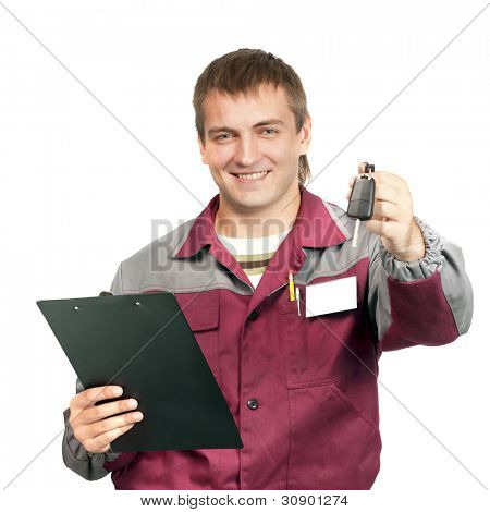 Mechanic with clipboard giving a car key. Isolated on white