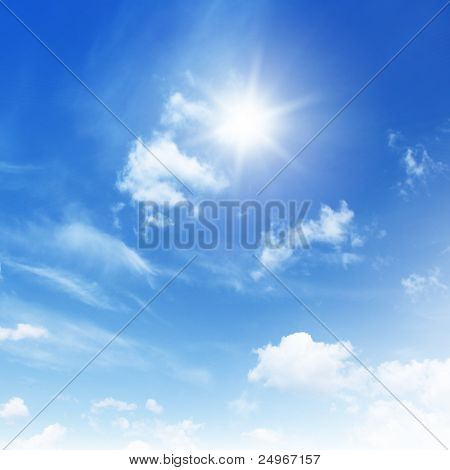 Blue sky with clouds and sun.