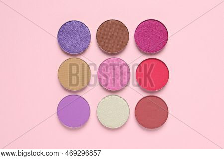 Different Beautiful Eye Shadows On Pink Background, Flat Lay