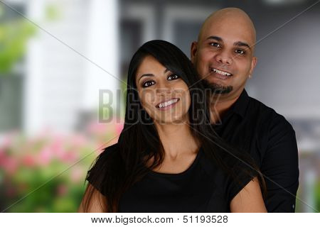 Nice minority family together outside their home