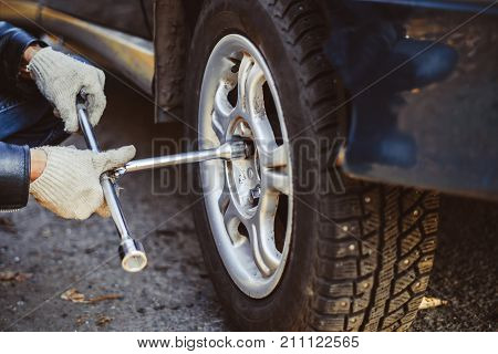 Change a flat car tire on road with Tire maintenance damaged car tyre