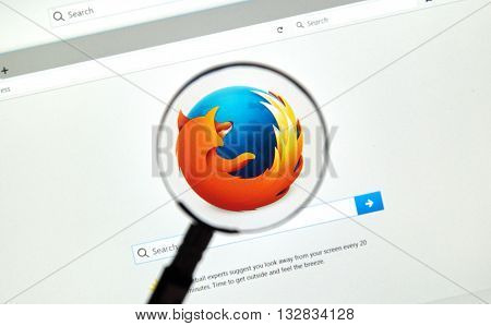 MONTREAL CANADA - JUNE 4 2016 : Firefox web browser under magnifying glass. Firefox is a free and open-source web browser developed by the Mozilla Foundation.