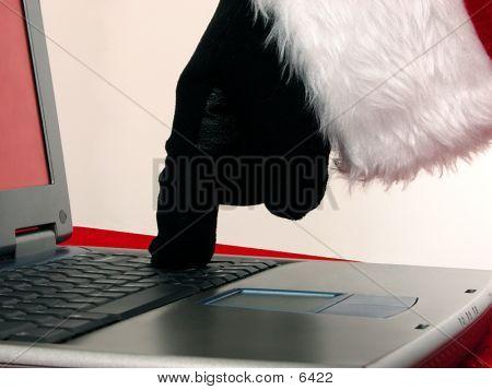 Santa hånd på bærbar Computer