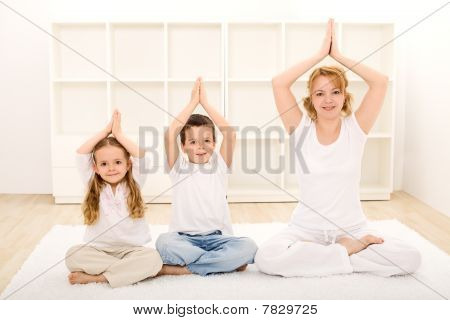 Family Doing Yoga Exercises