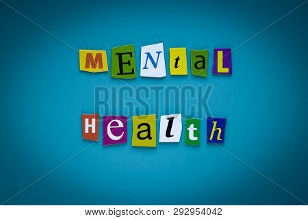 A Word Writing Text - Mental Health - Of Cut Letters On A Blue Background. Headline - Mental Health.