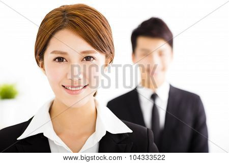 Happy Business Man And Woman Standing  In Office