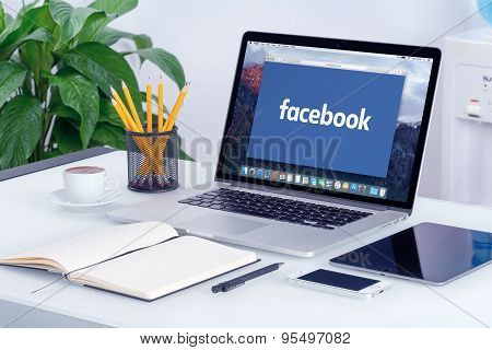 Facebook New Logo On The Apple Macbook Pro Screen That Is On Office Desk