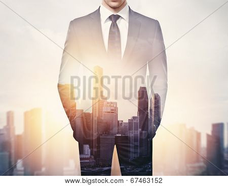 double exposure of businessman and city