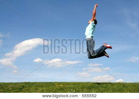 Man Jumping Against Blue Sky