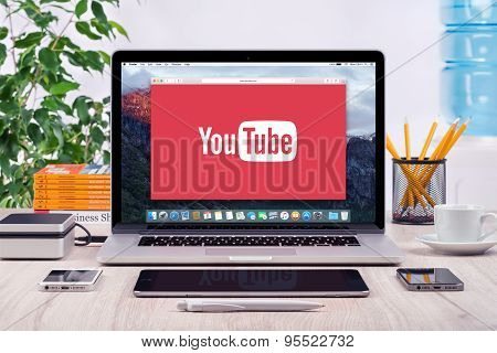 Youtube Logo On The Apple Macbook Pro Display That Is On Office Desk In Modern Office Work Place