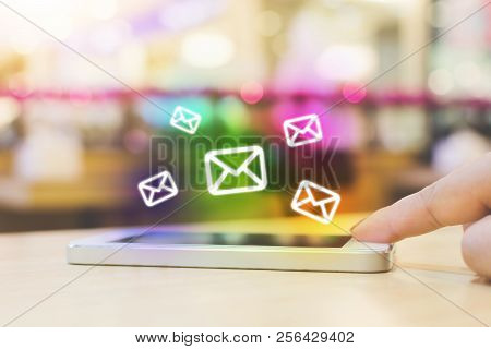 Woman Hand Using Mobile Phone With E-mail Application, Concept Email Marketing And Newsletter