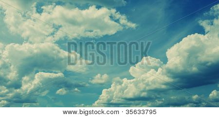 white fluffy clouds in the blue sky