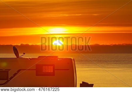 Caravan On Sea At Sunrise.