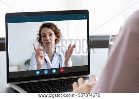 Patient Have Online Video Consultation With Doctor On Laptop