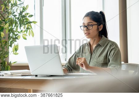 Indian Young Lady Teacher Or Student Watching Online Education Video Workshop Webinar, Distant Web S