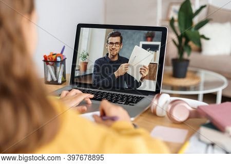 Remote Learning. Male Teacher Having Online Math Class With Pupil, Explaining Task Using Webcam. Gir