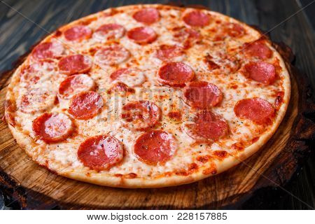 Delicious Fresh Baked Pizza With Pepperoni And Cheese, Close Up. Italian Traditional Cuisine, Fast F