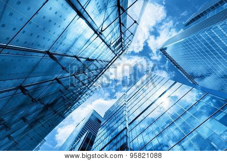 Modern business skyscrapers, high-rise buildings, architecture raising to the sky, sun. Concepts of financial, economics, future etc.