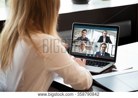 Female Employee Have Team Web Conference On Laptop