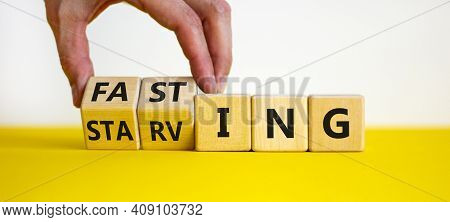 Fasting Or Starving Symbol. Doctor Turns Wooden Cubes And Changes The Word 'starving' To 'fasting'. 