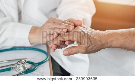 Elderly Senior Adult Patient (older Person) Having Geriatric Doctor (geriatrician) Consulting And Di