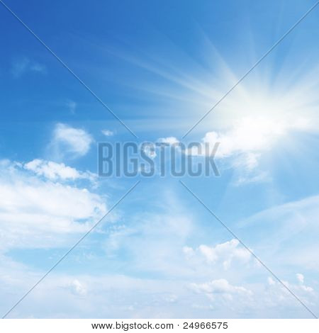 Blue sky with clouds and sun.