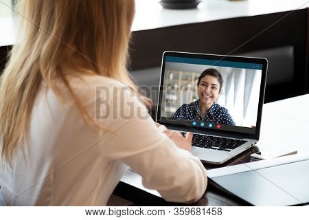 Businesswoman Having Distant Negotiations Using Video Conference Application On Pc