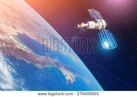 Space Communications Satellite In Orbit Around The Earth. Elements Of This Image Furnished By Nasa